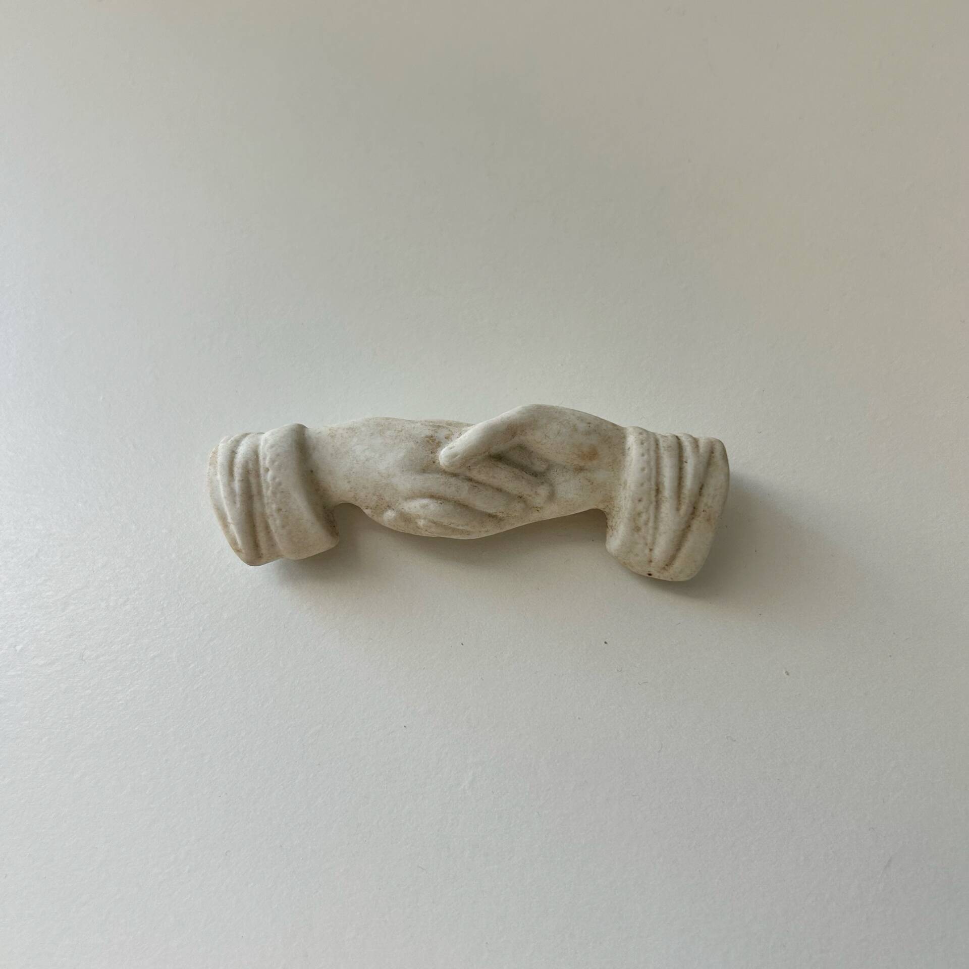 Knife holder with hands joined