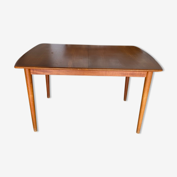 Teak dining table with extension by Johannes Andersen made in Denmark of the 60s.