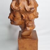 Bust of a laughing child in patinated plaster, 35 cm