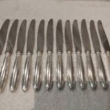 12 silver-plated table knives, Christofle goldsmith ribbons
