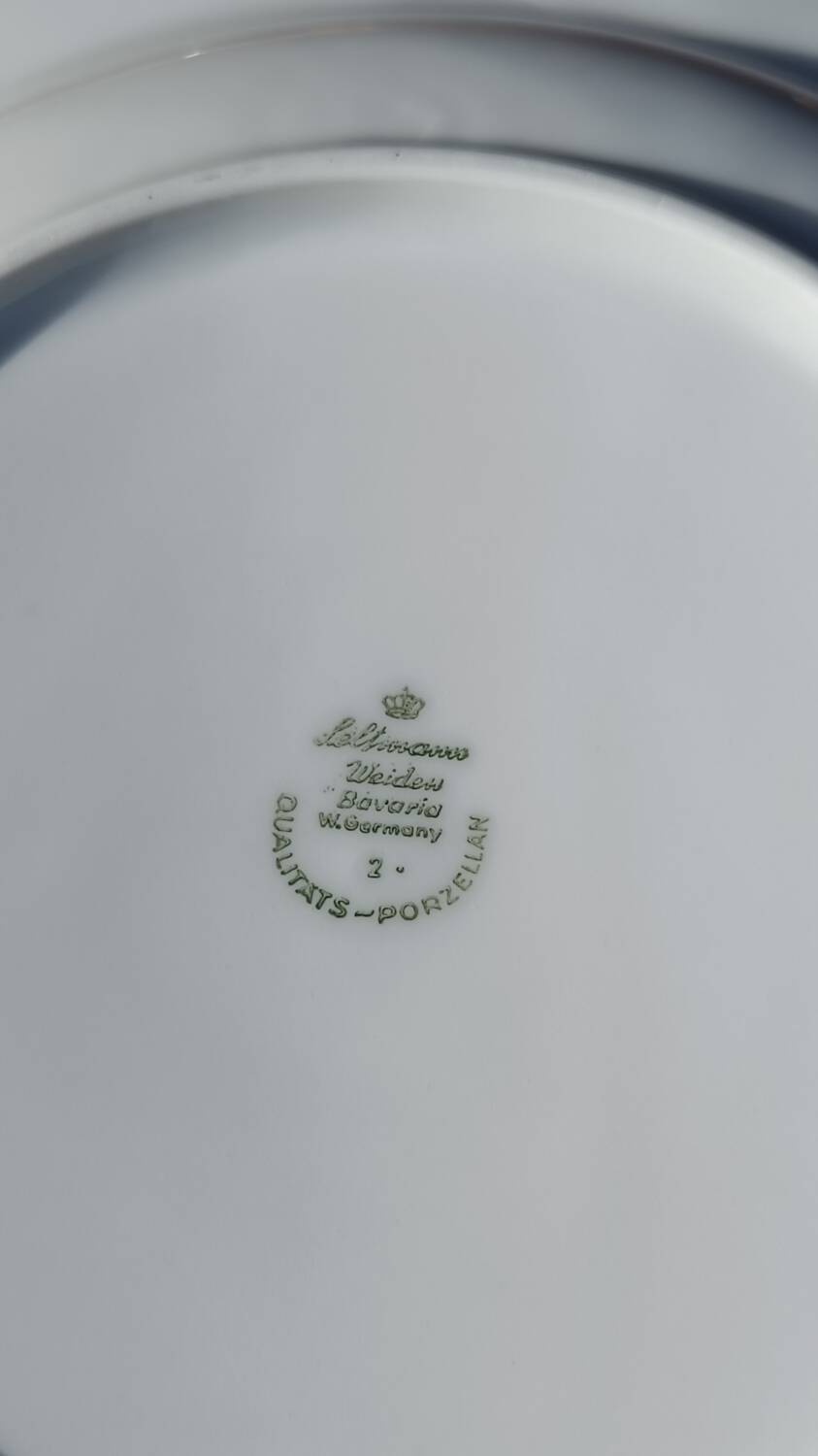 Twelve white porcelain plates