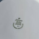 Twelve white porcelain plates