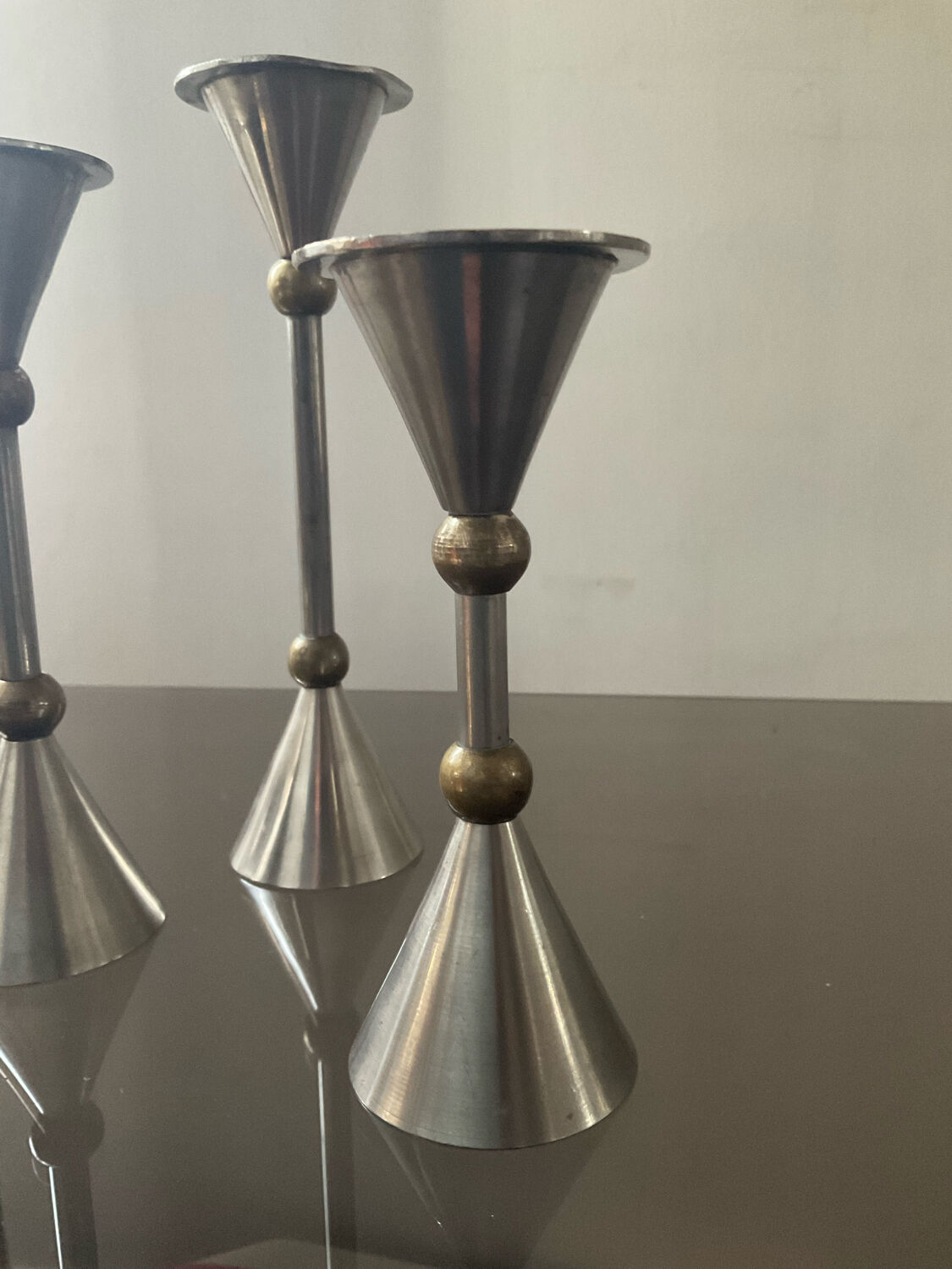Trio of vintage metal and bronze candle holders