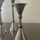 Trio of vintage metal and bronze candle holders