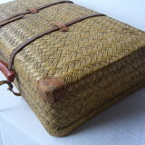 Old rattan case with leather straps and wooden handle