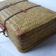Old rattan case with leather straps and wooden handle