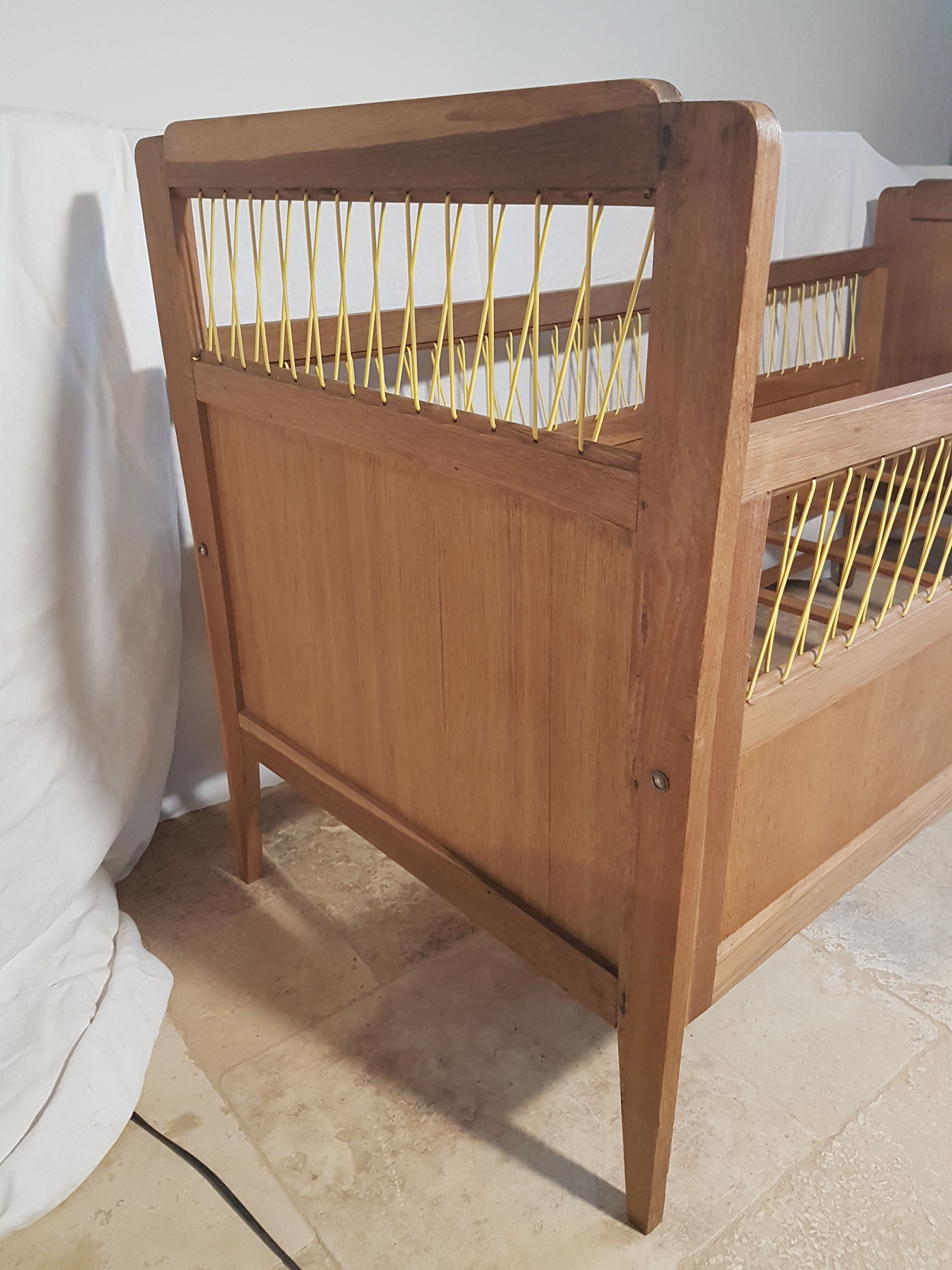 Children's bed made of wood and yellow scoubidou, 1950s.