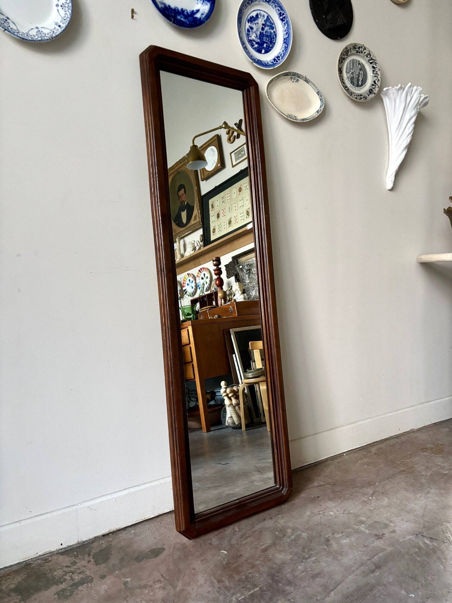 Full-length rectangular mirror in dark wood