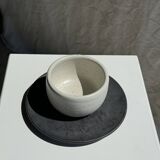 White Indonesian ceramic cup and gray saucer