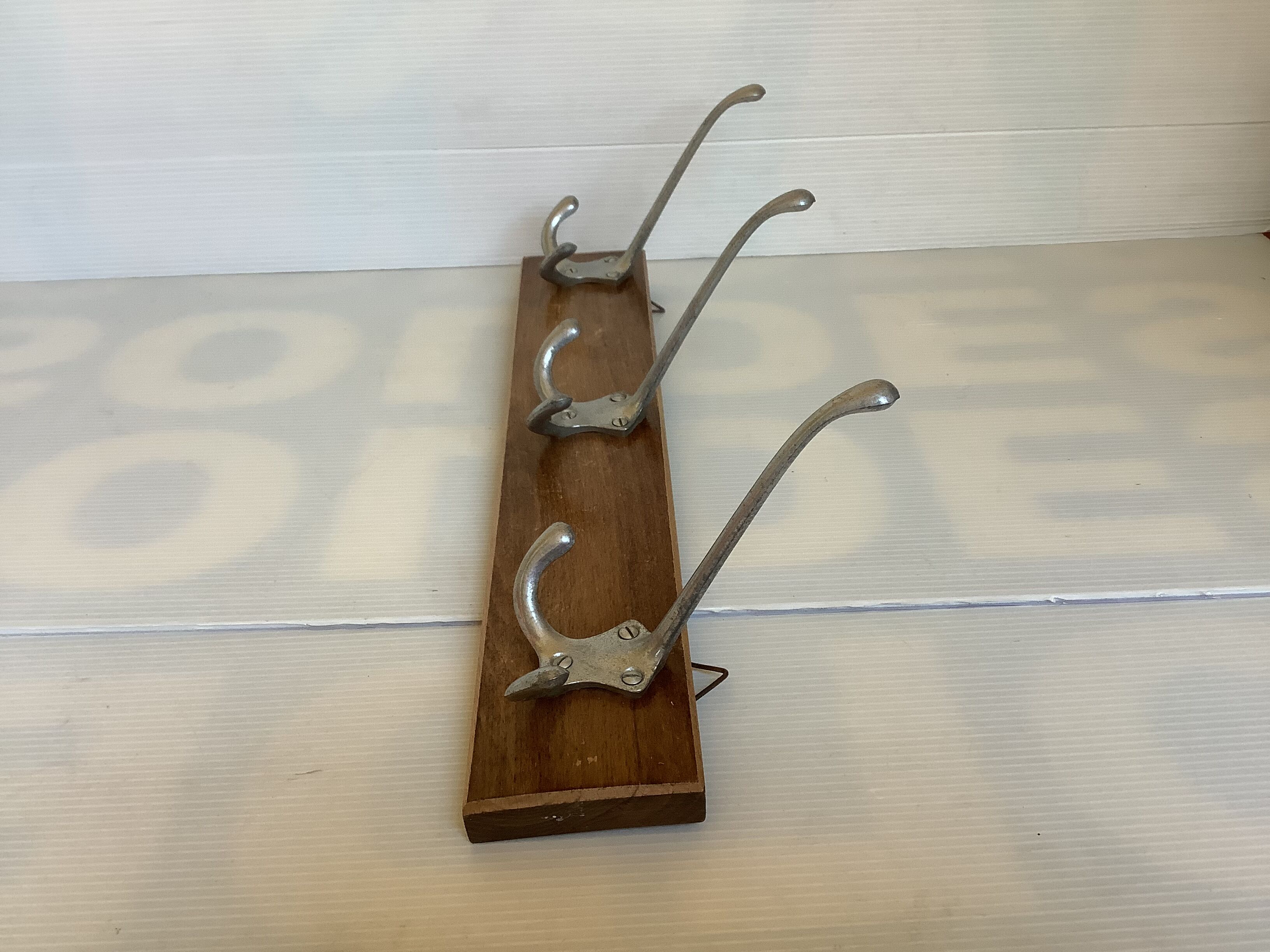Old coat rack wood metal three hooks