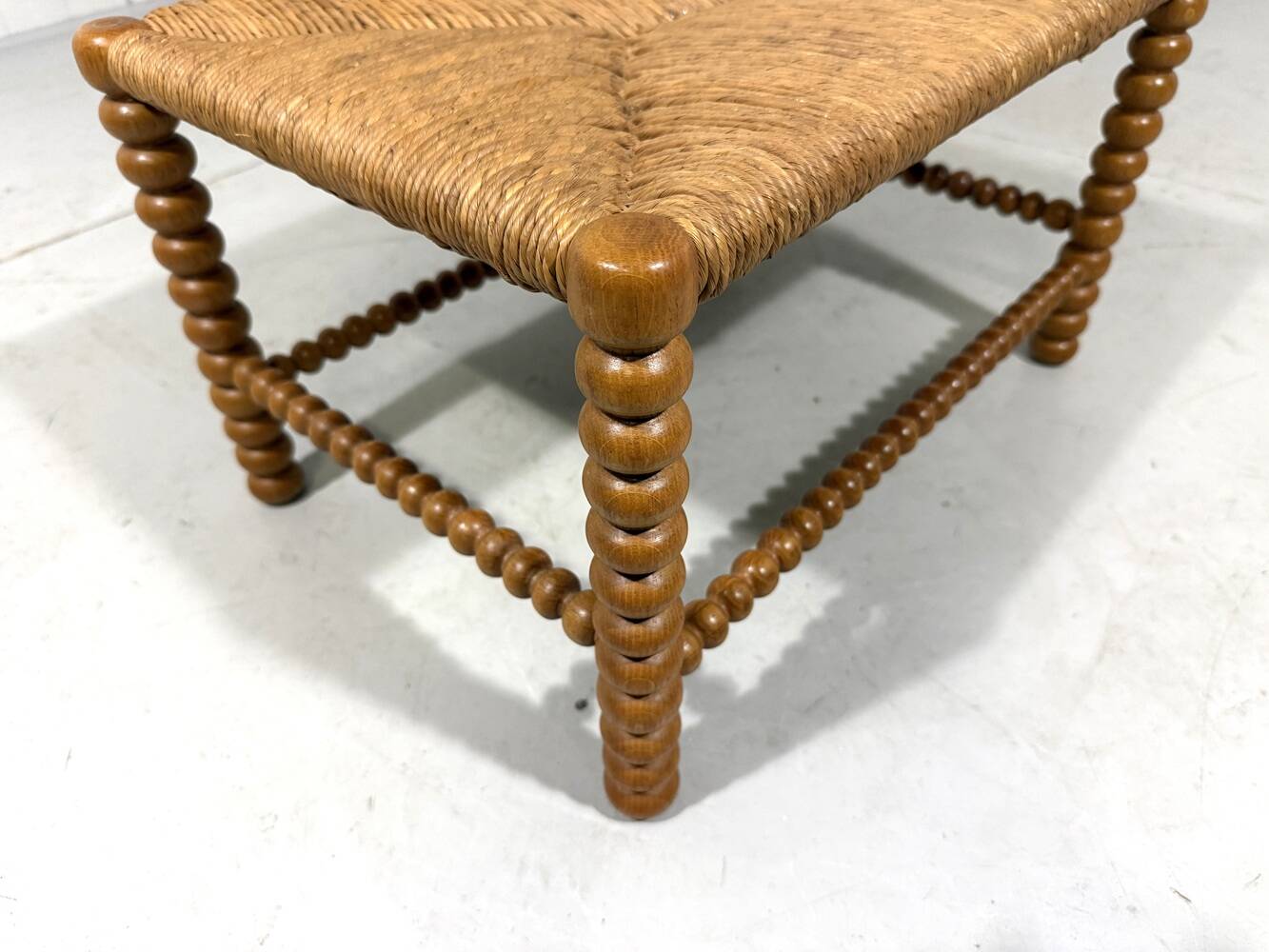 Low oak bobbin stool with rush seat 1930’s