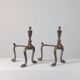 Paire de chenets en laiton au design zoomorphe vintage.