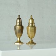 Pair of patinated brass salt and pepper shakers, 20th century.