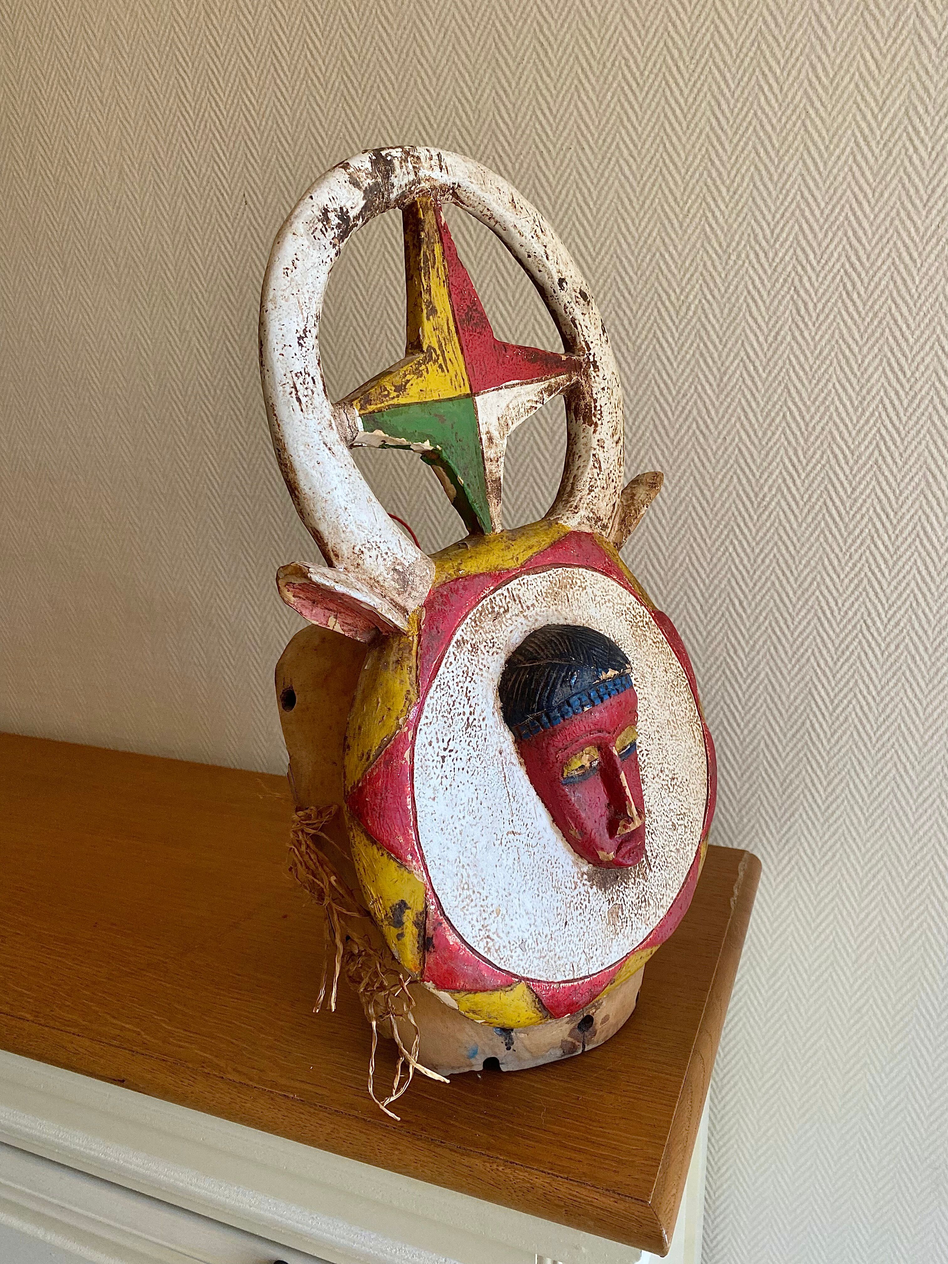 Polychrome carved wooden African mask