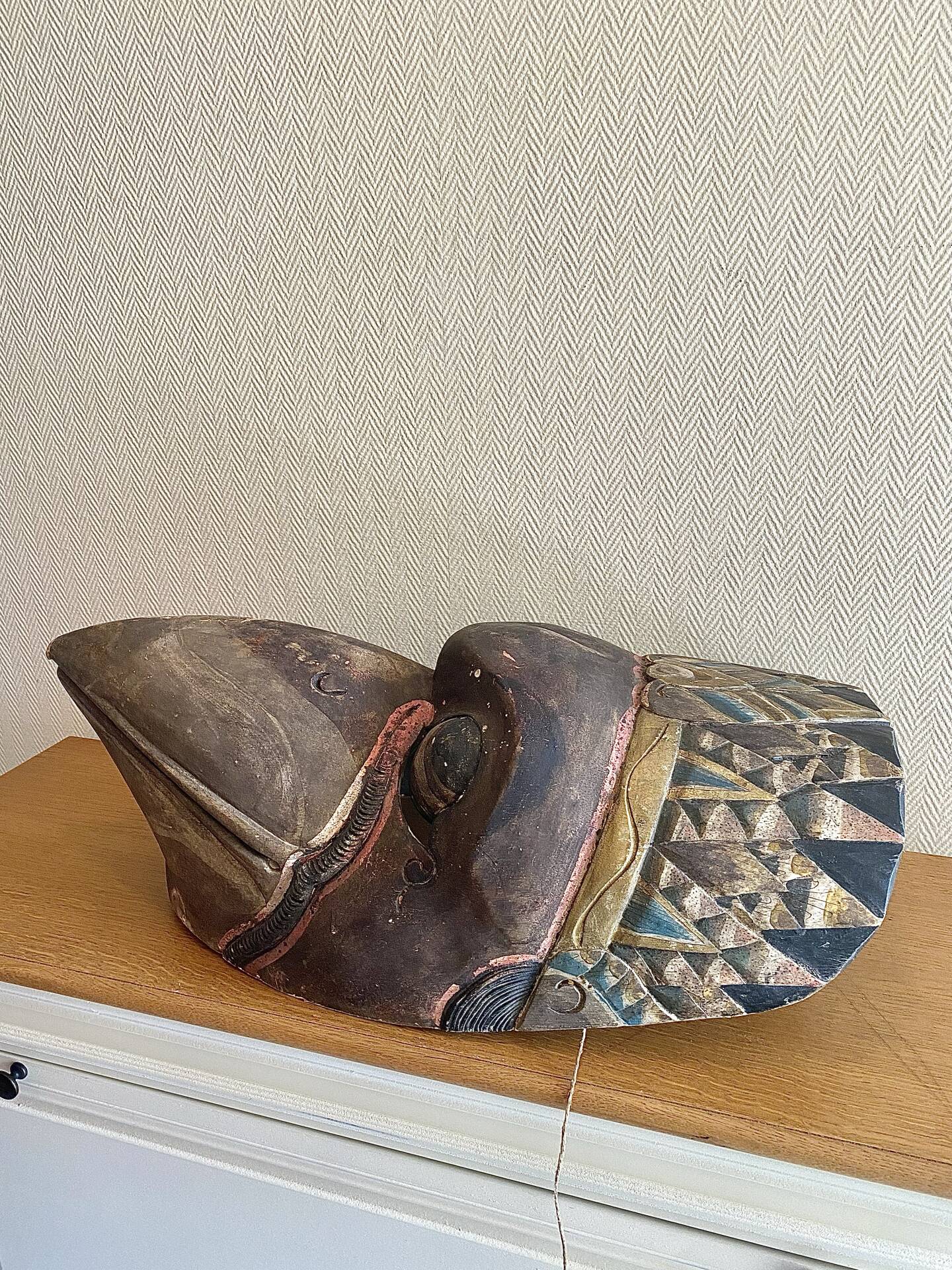 Grand traditional Indonesian mask carved from wood.