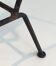Black lacquered metal magazine rack with brown leather.