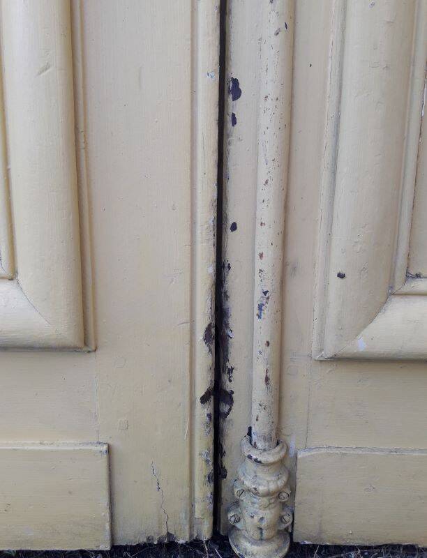 19th century double arched entrance door in oak with grilles and old glass