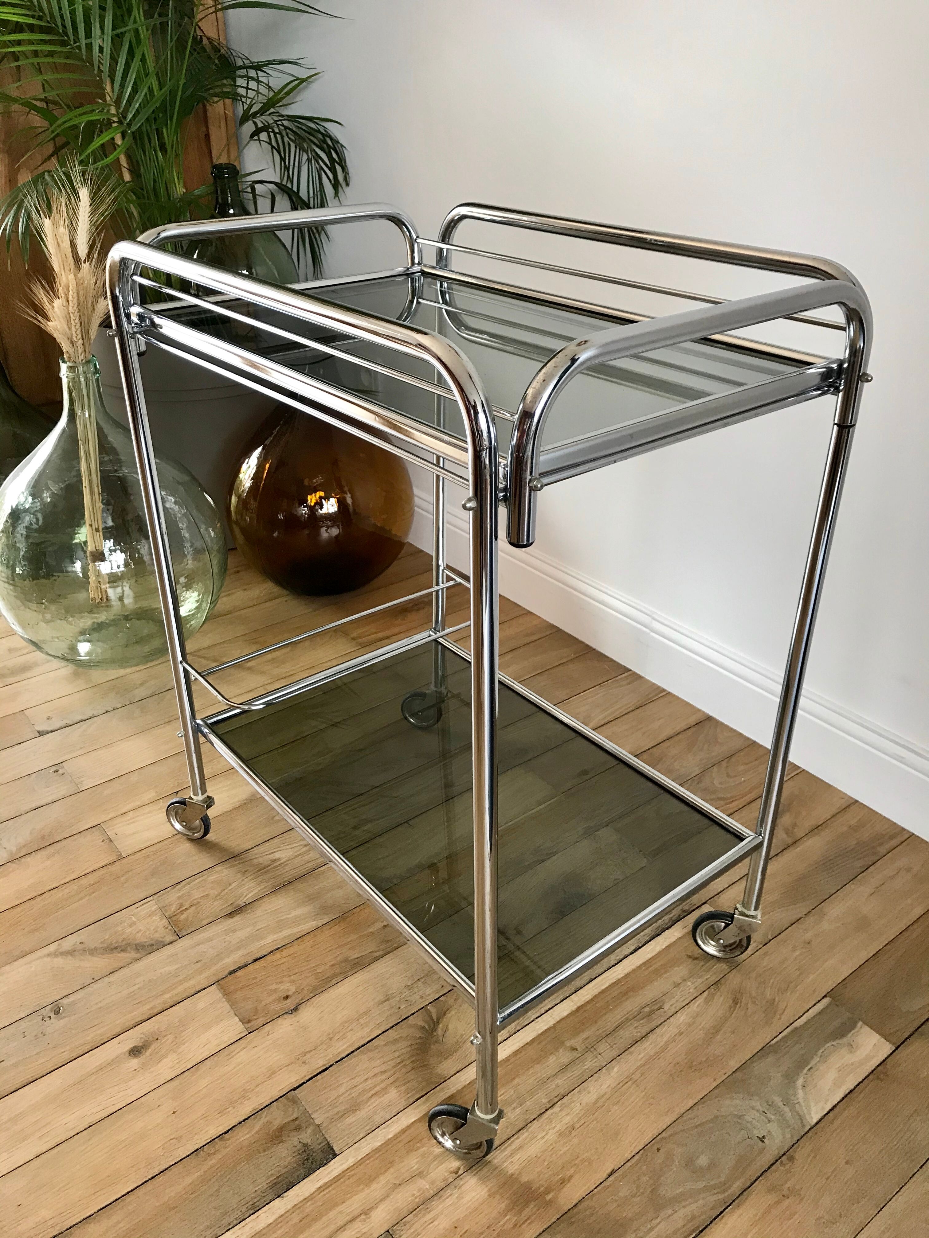 Serving in chrome steel and smoked glass 70s