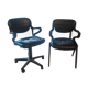 Two black leather armchairs