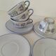 Glazed earthenware cups and saucers