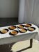 Set of 7 small flat dessert plates in orange stoneware D18