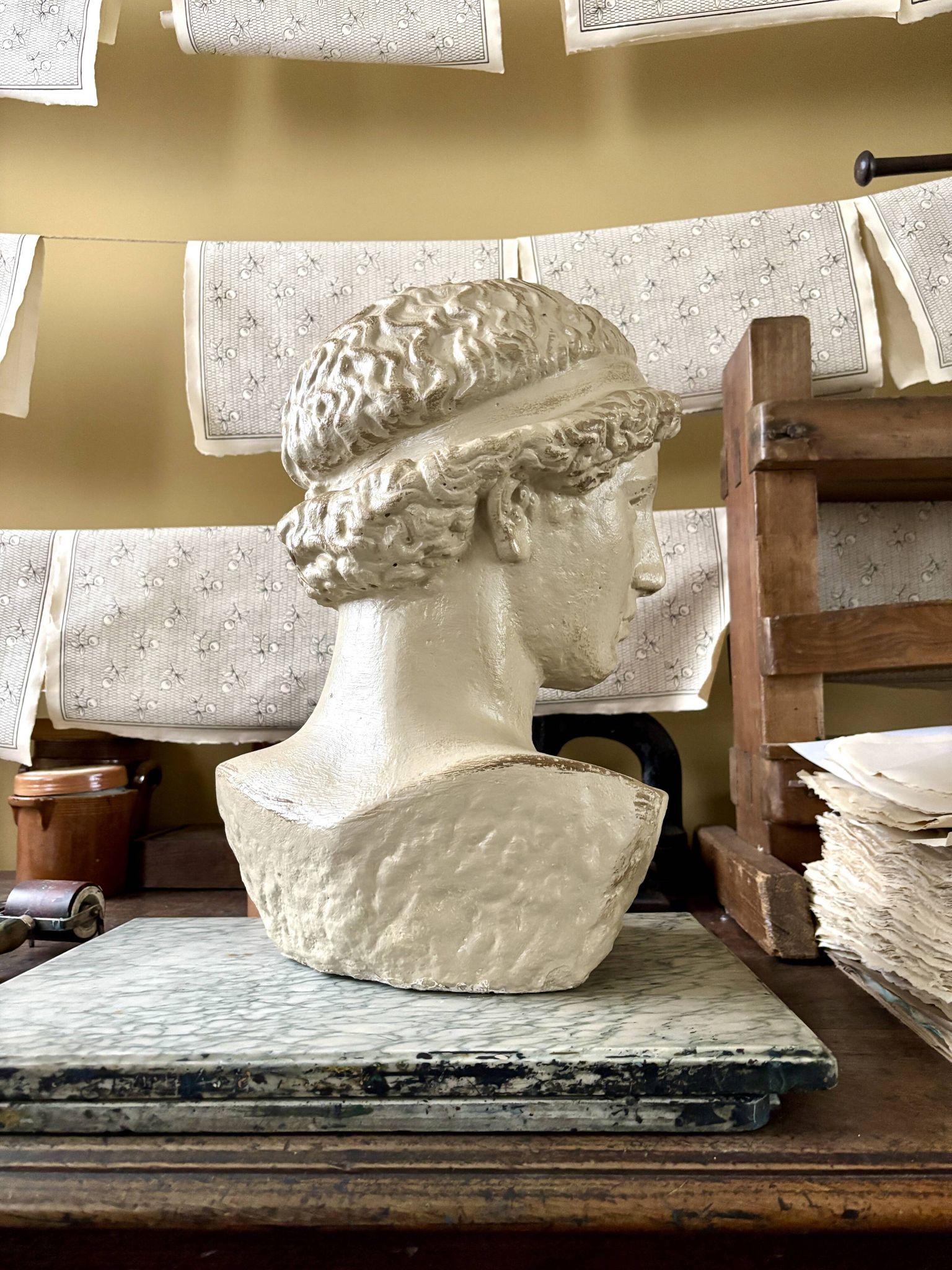 Concrete bust painted in beige - reproduction, detail of "The Dying Slave"
