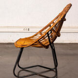 Rattan armchair with metal legs