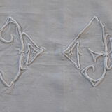 Old white linen tablecloth and stylized monogram embroidery days and plumetis