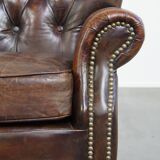 Classic grained cognac colored cowhide leather Chesterfield armchair