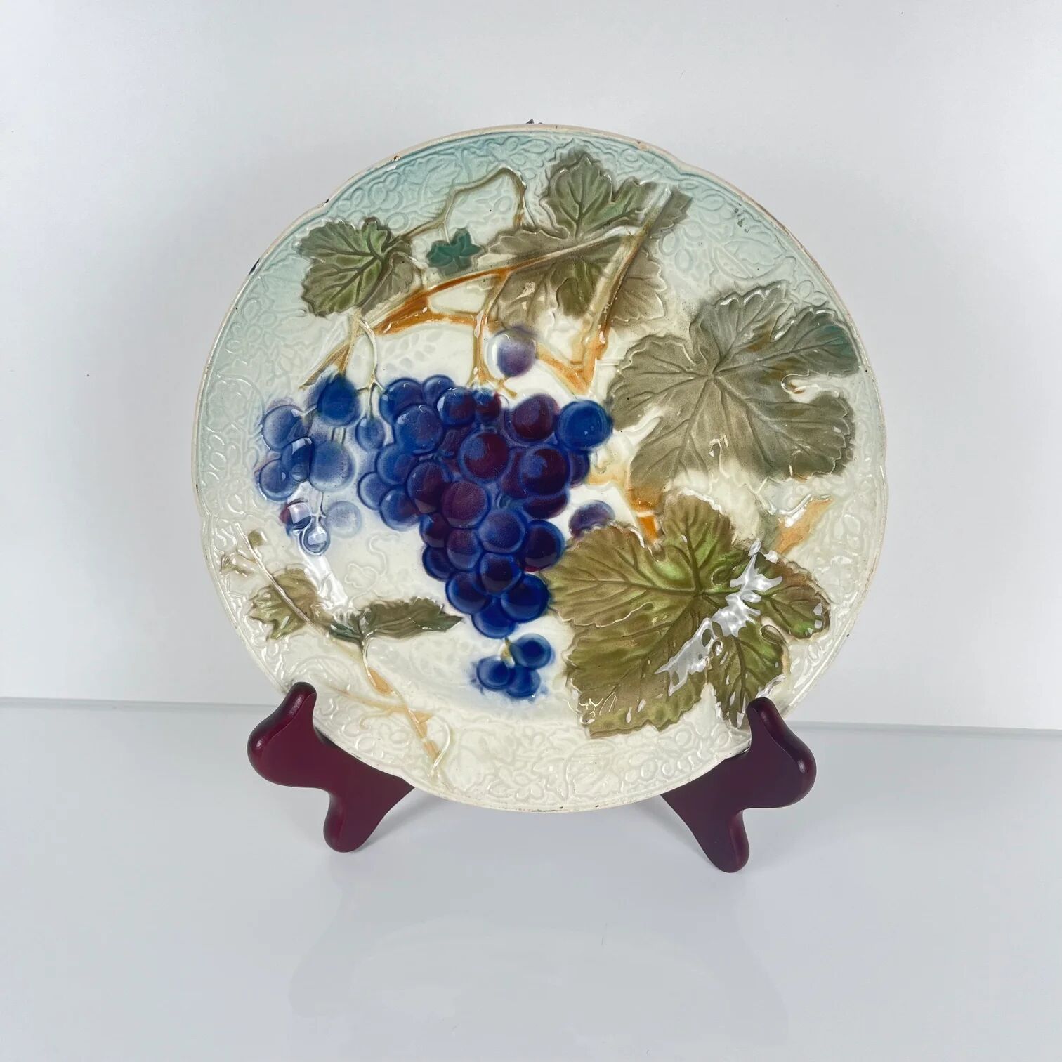 Set of 4 plates KG St Clément barbotine fruit (cherry, mirabelle, grape, pear), late 19th-early 20th century.