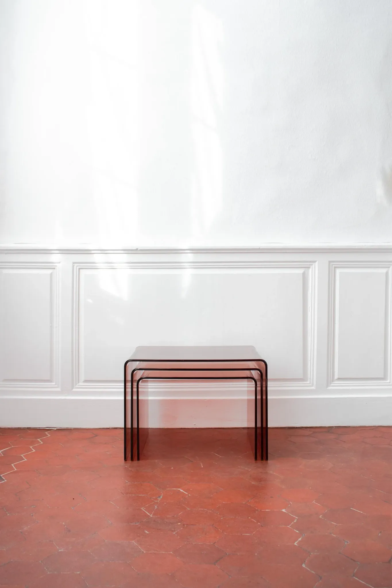 Vintage trio of nesting tables in smoked plexiglass by Michel Dumas, year