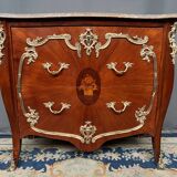 Louis XV style commode. Marquetry, gilded bronze decoration.