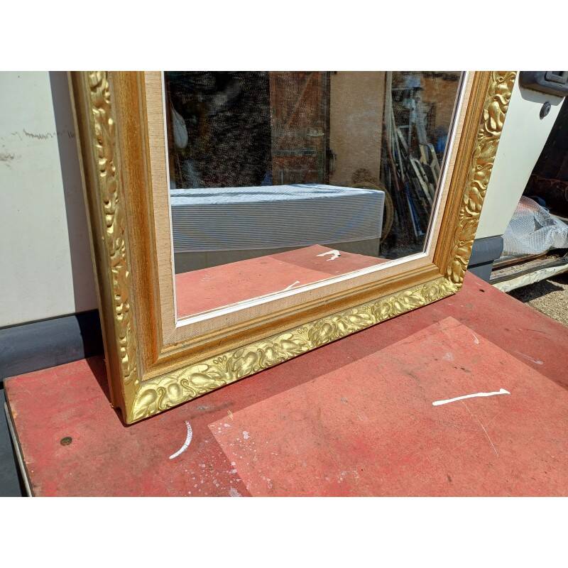 Wooden mirror and gold trim