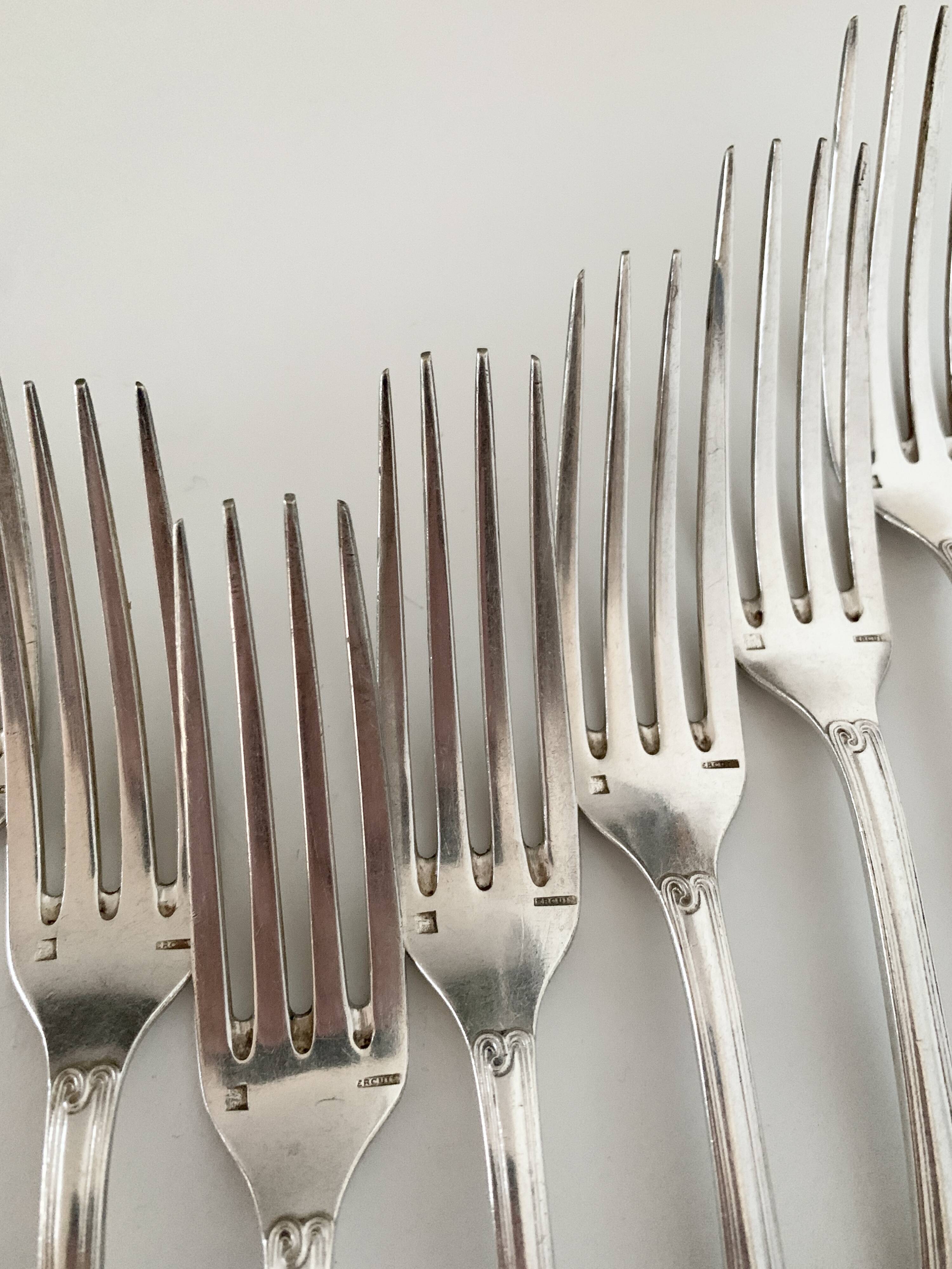 Nine large Ercuis silver-plated forks