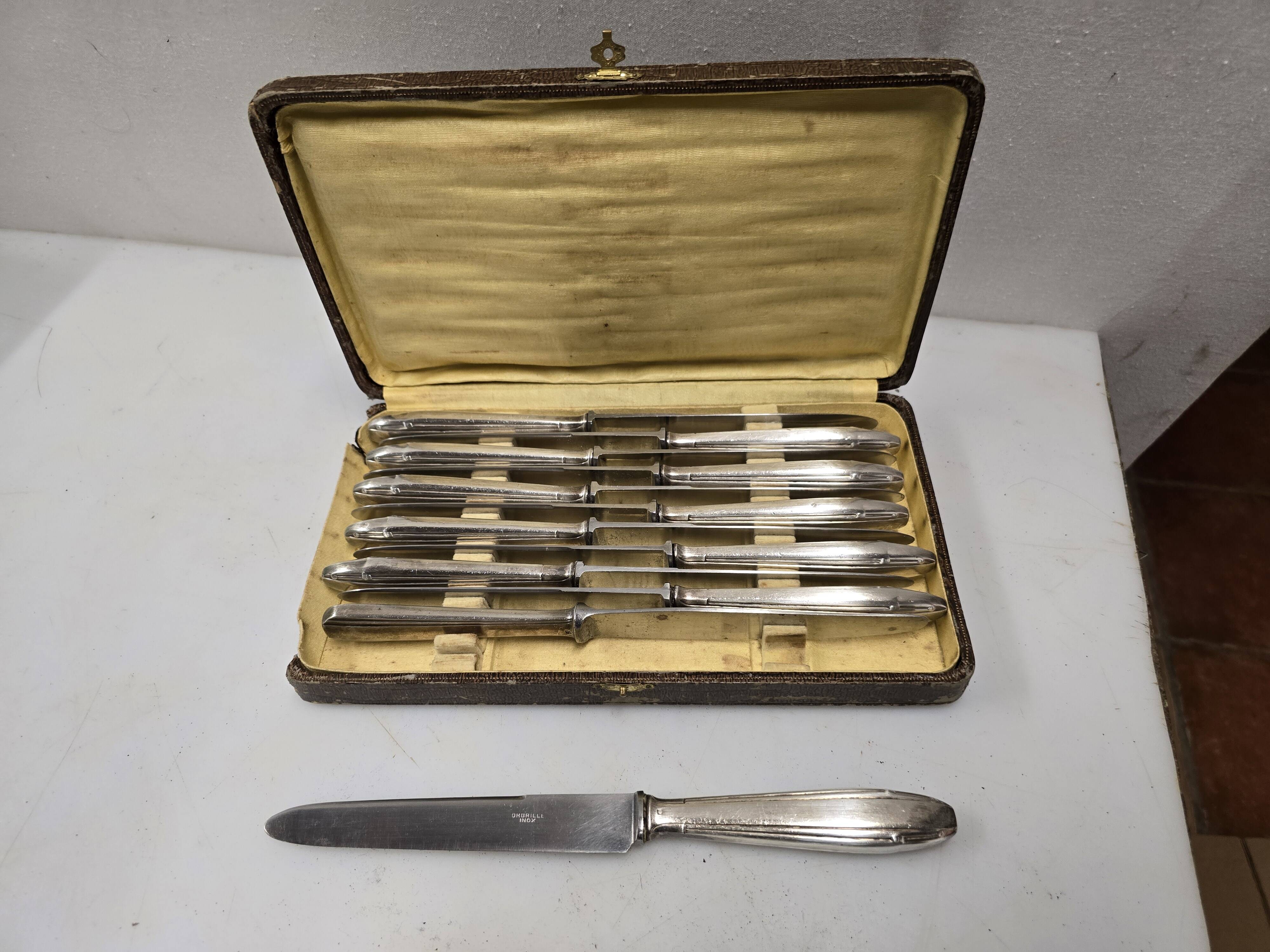12 silver-plated knives from the mid-20th century