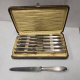 12 silver-plated knives from the mid-20th century