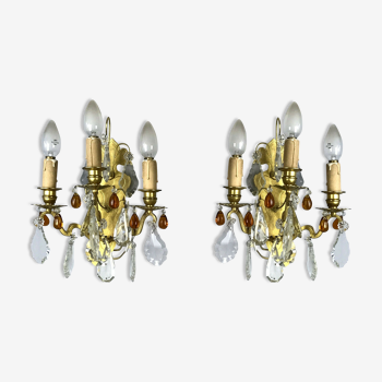 Pair of antique bronze appliques with amber-colored stamps and drops