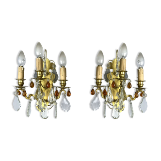 Pair of antique bronze appliques with amber-colored stamps and drops