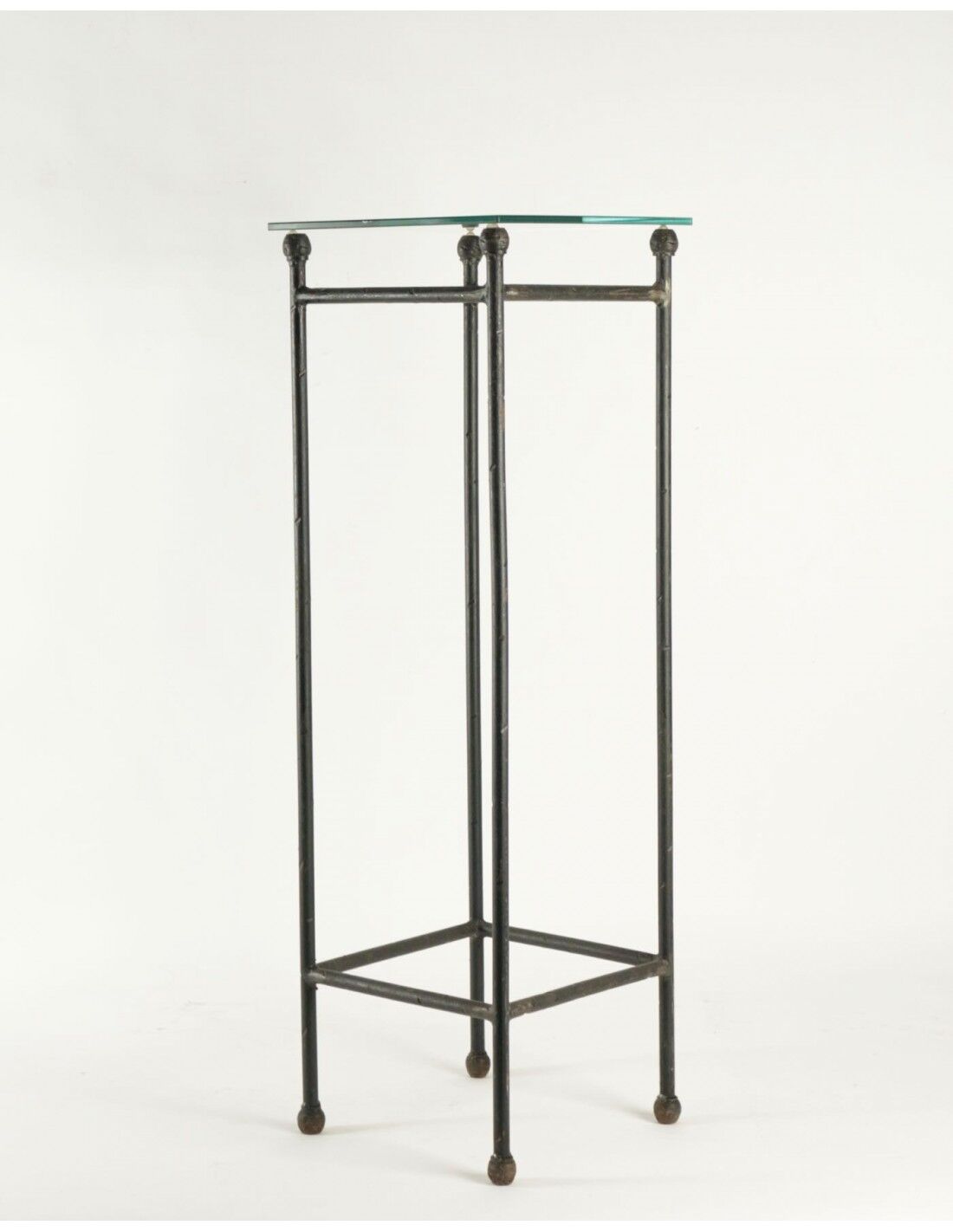 Two consoles, wrought iron sheaths on glass top, twentieth century