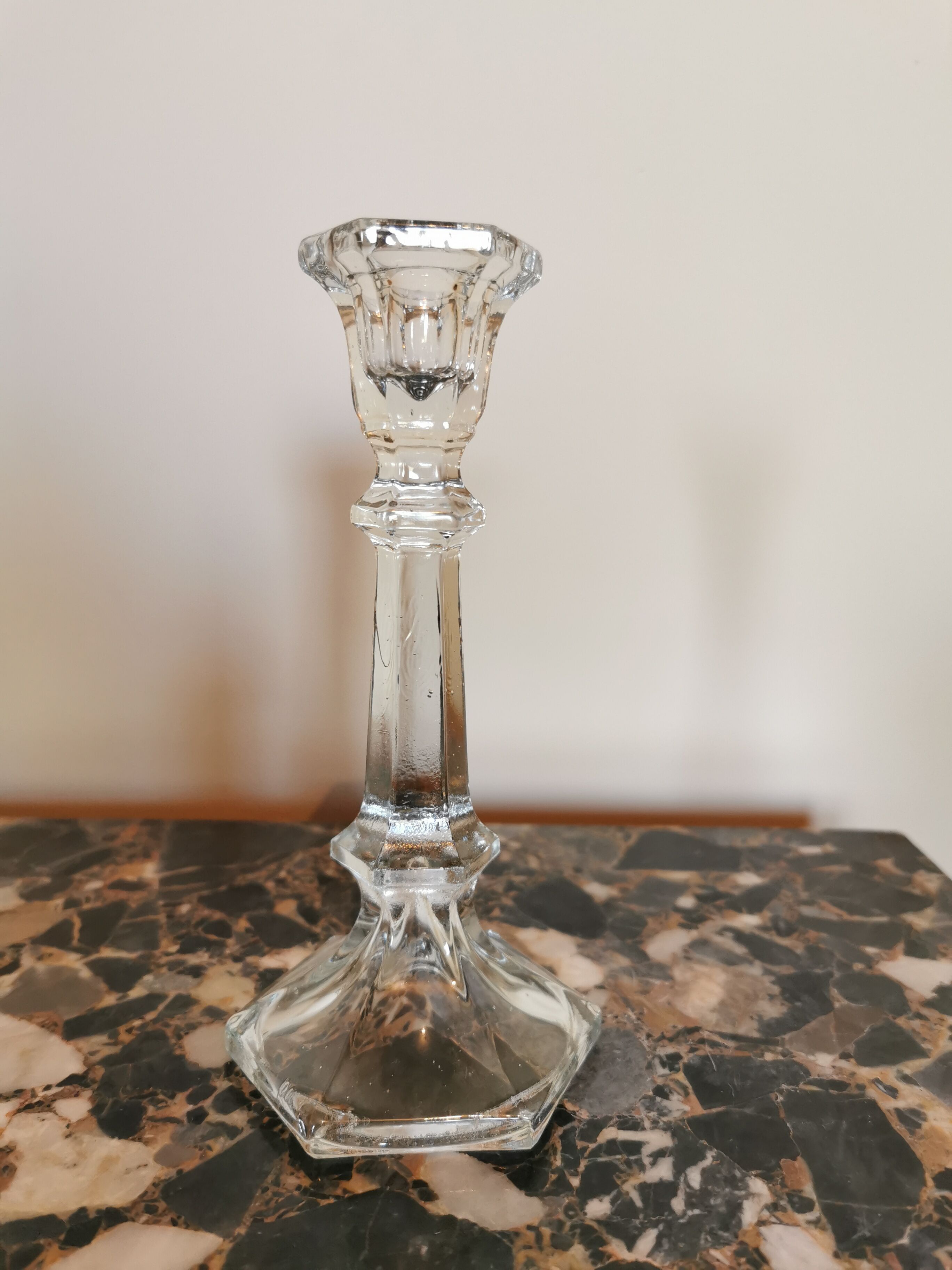 Pair of antique candle holders in transparent glass