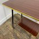 Vintage side table, brass gallery and wheels, 1950s.
