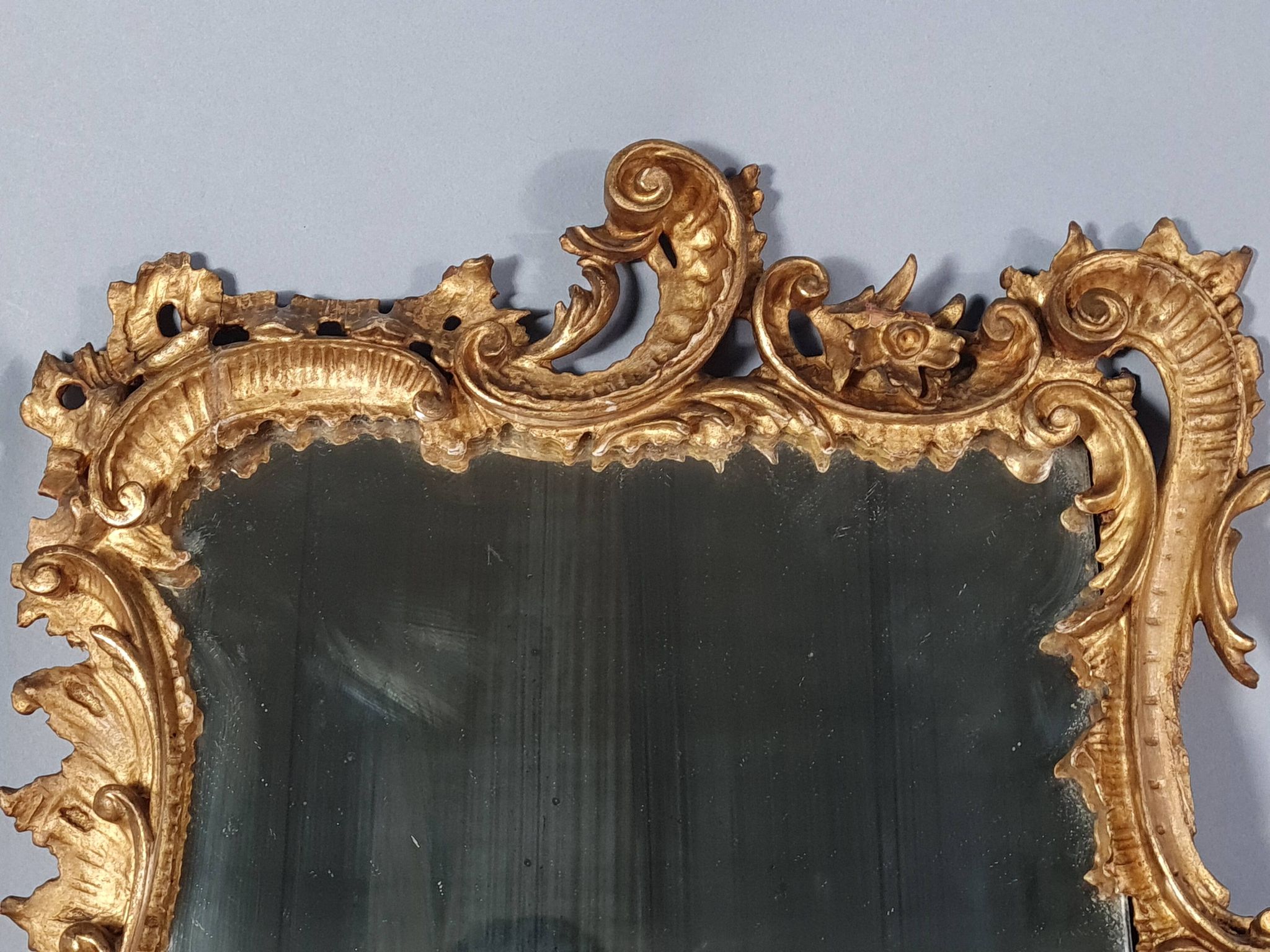 Mirror circa 1800, carved and gilded wooden frame, rocaille decoration, 54x39 cm, C227