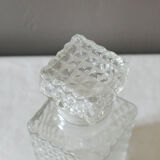 Transparent vintage decanter in chiseled glass and its hermetic cap 70's years