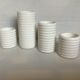 Four white earthenware candle holders