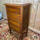 Louis XVI style molded and carved walnut chest of drawers