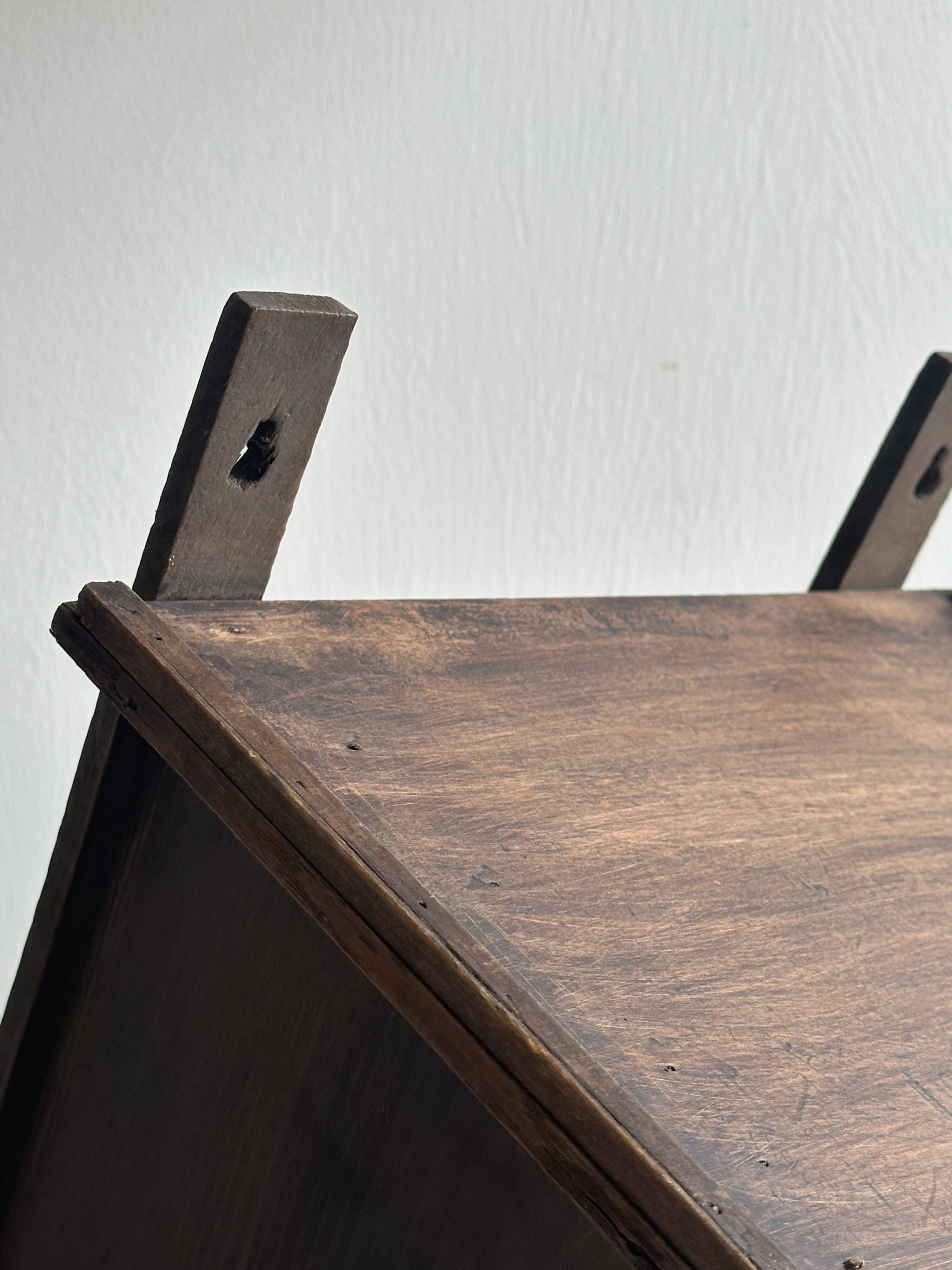 Antique wooden wall shelf.