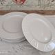 Set of 7 flat plates in white Limoges porcelain geometric decoration in relief