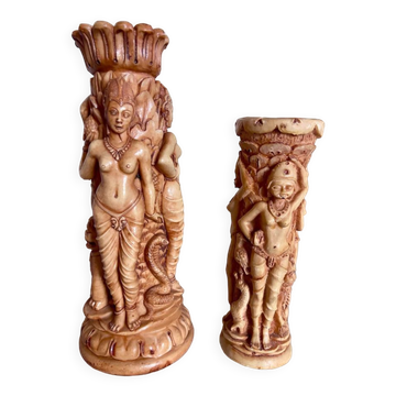 Two ancient Indonesian candlesticks.