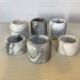 Six bougeoirs en marbre