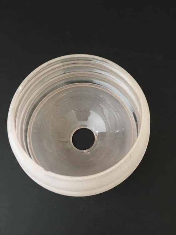 Round globe in slightly pink granite glass and white glass